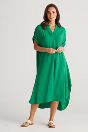 A model wearing the Canal Overshirt in colour Jade (Green), from the front, showing the whole outfit