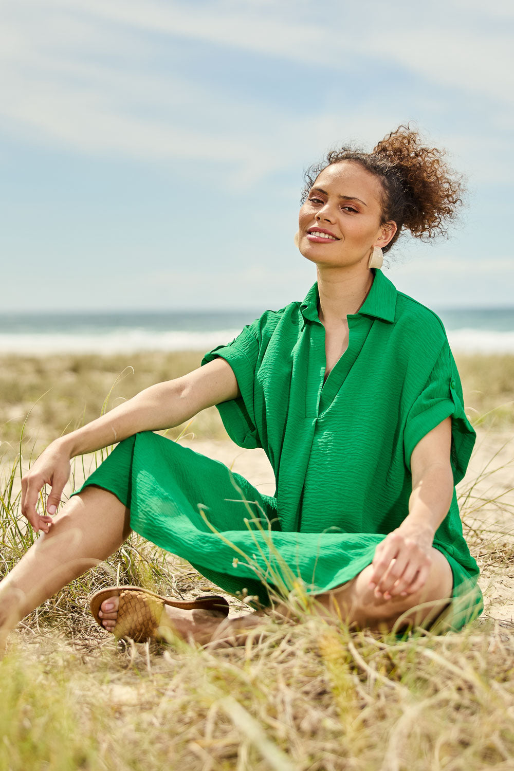 Model Lala wearing the Canal Overshirt in colour Jade (Green), from the front, showing the whole outfit