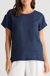 A model wearing the Captain Linen Tee in colour Navy (Blue), from the front, cropped image