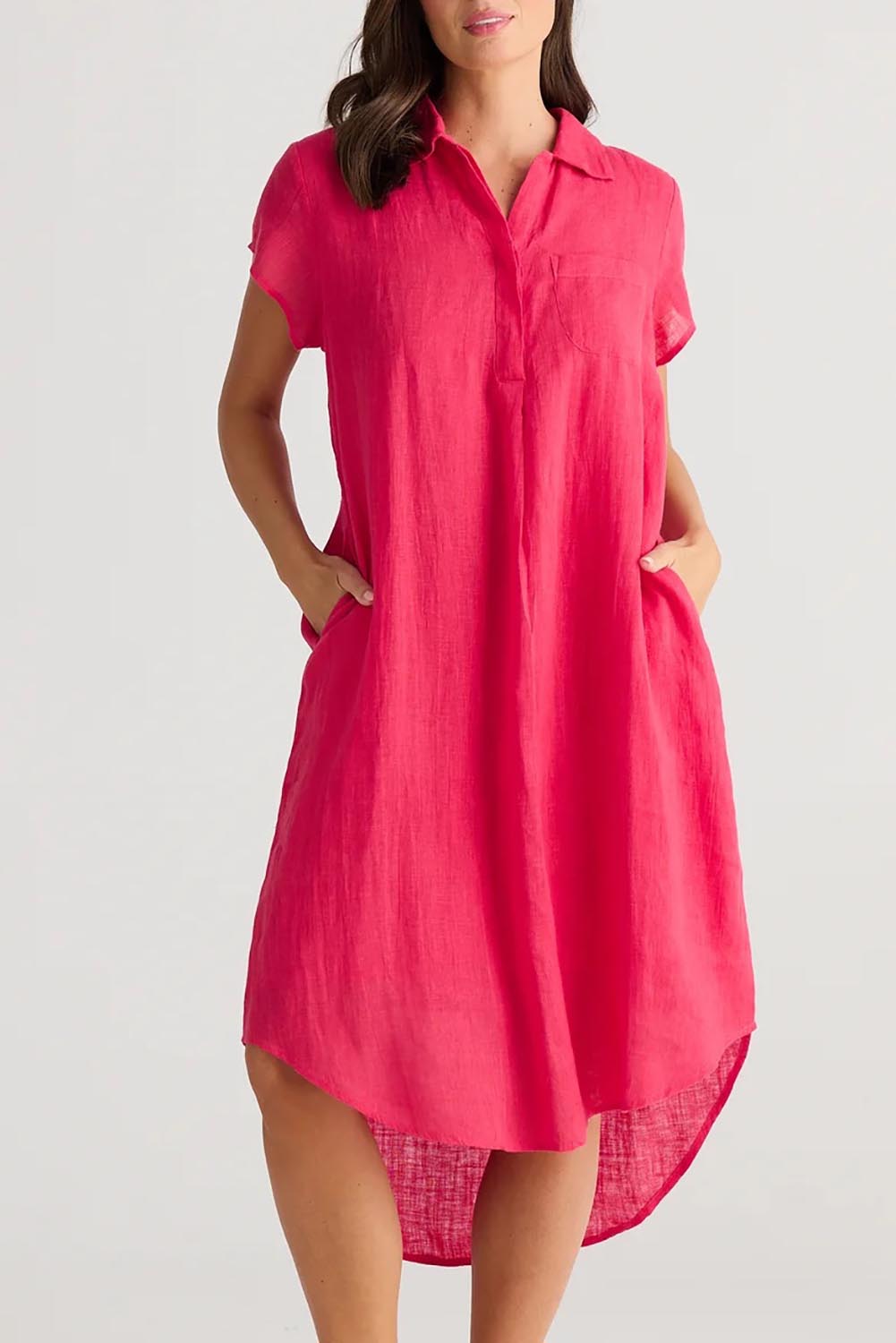 A model wearing the Ahoy Linen Tunic in colour Raspberry (Pink), from the front, cropped image