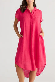 A model wearing the Ahoy Linen Tunic in colour Raspberry (Pink), from the front, cropped image