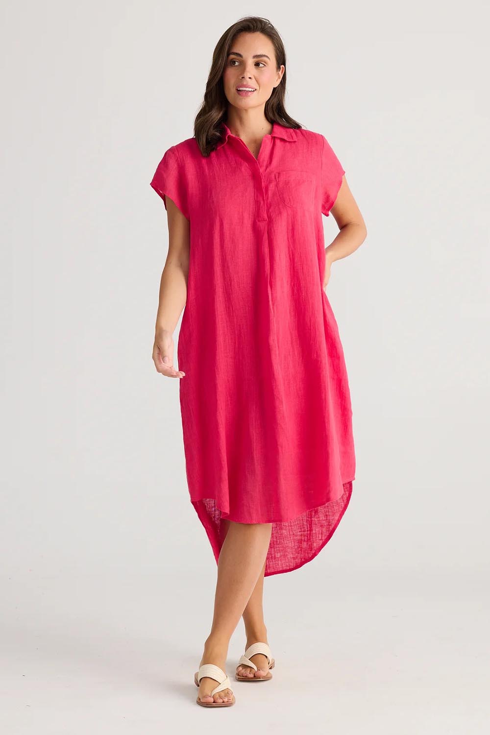 A model wearing the Ahoy Linen Tunic in colour Raspberry (Pink), from the front, showing the whole outfit