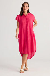 A model wearing the Ahoy Linen Tunic in colour Raspberry (Pink), from the front, showing the whole outfit