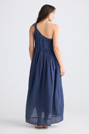 A model wearing the Lana Linen Maxi Dress in colour Navy (Blue), from the back
