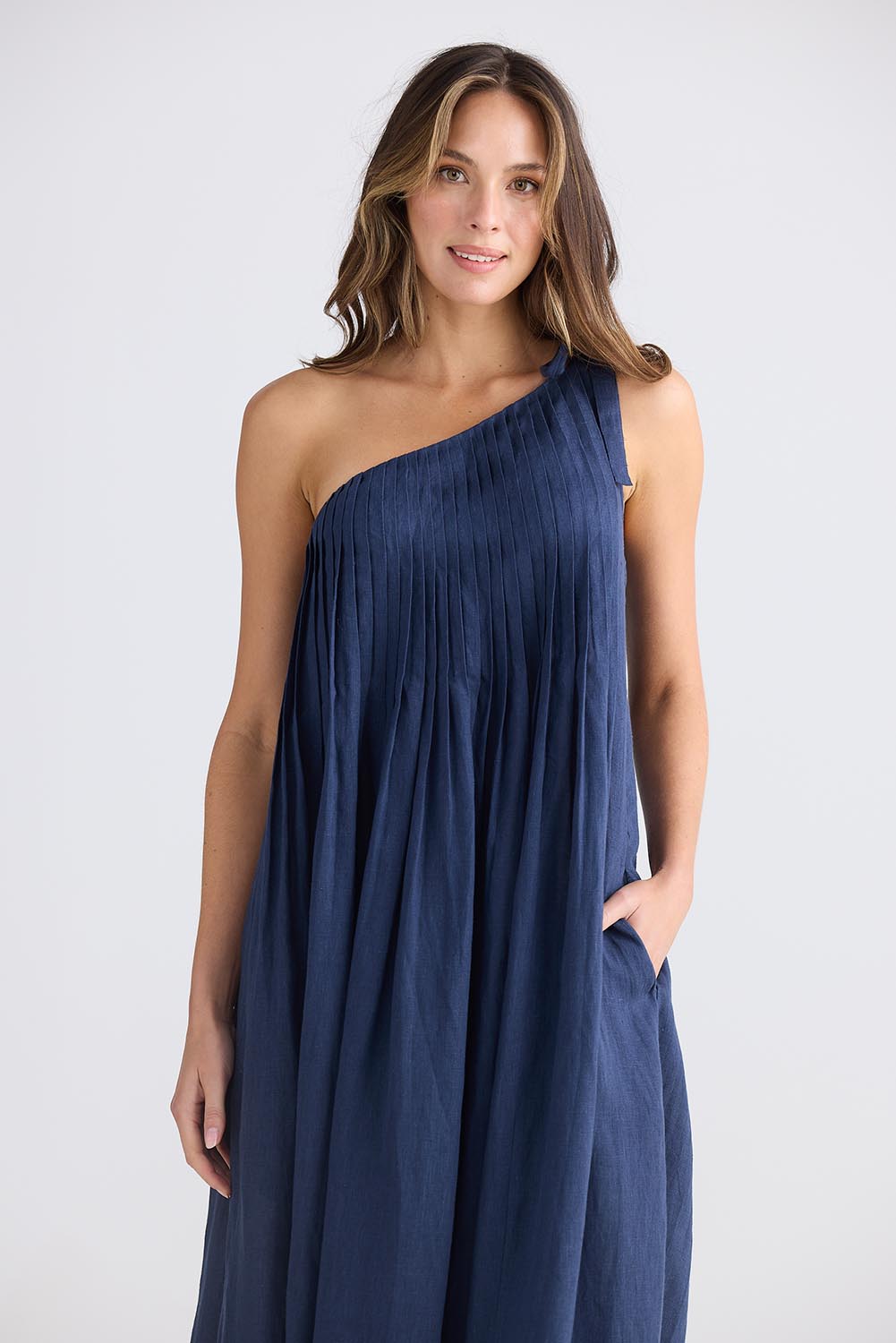 A model wearing the Lana Linen Maxi Dress in colour Navy (Blue), from the front, cropped image