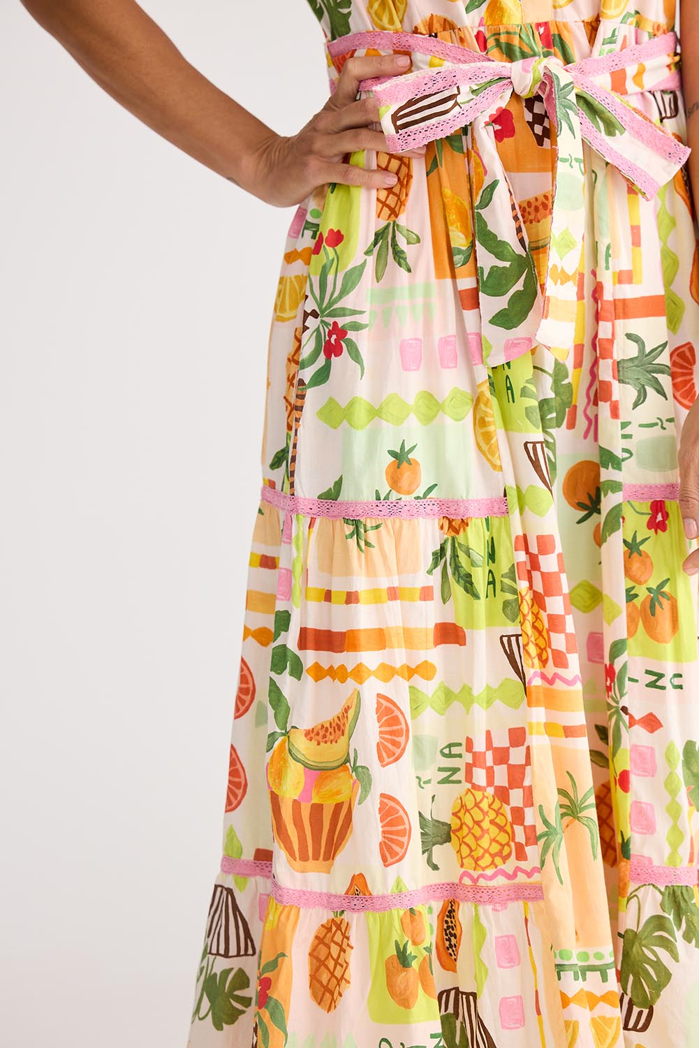 A model wearing the Avery Cotton Maxi Dress in colour Tropical, from the front, cropped image