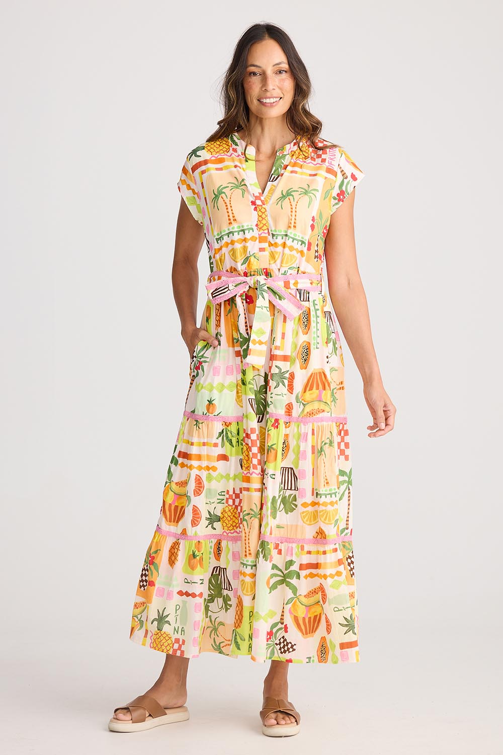 A model wearing the Avery Cotton Maxi Dress in colour Tropical, from the front, showing the whole outfit
