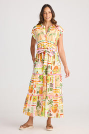 A model wearing the Avery Cotton Maxi Dress in colour Tropical, from the front, showing the whole outfit