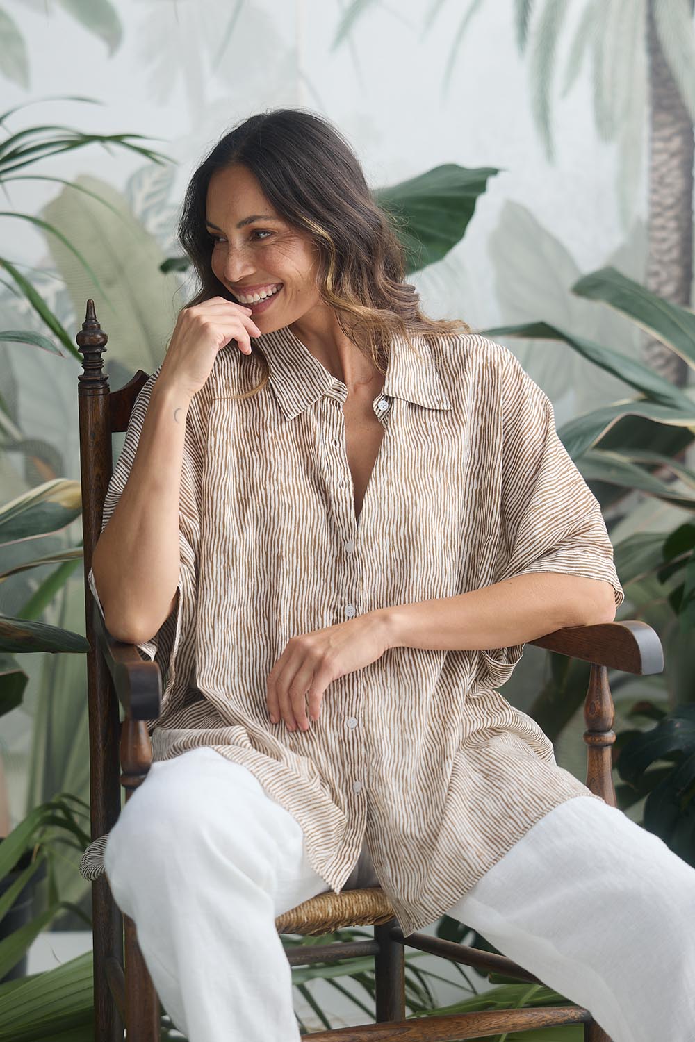 A model wearing the Indigo Cotton Shirt in colour Taupe, from the front, showing the whole outfit
