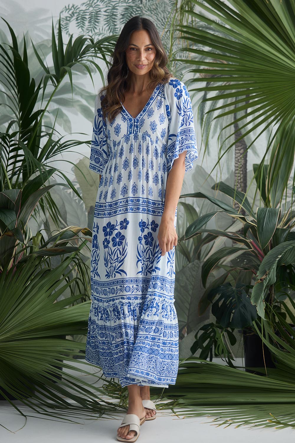 A model wearing the Swell Maxi Dress in colour Oceanpara (Blue), from the front, showing the whole outfit