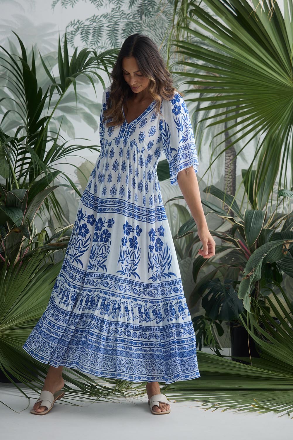A model wearing the Swell Maxi Dress in colour Oceanpara (Blue), from the front, showing the whole outfit