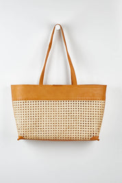 A model wearing size OneSize of the Ciao Basket Bag in colour Natural, from the front, showing the whole outfit