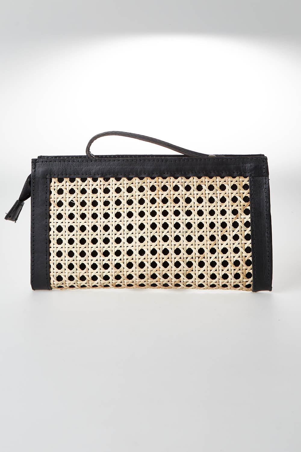A model wearing size OneSize of the Raffles Clutch in colour Black, from the front, showing the whole outfit