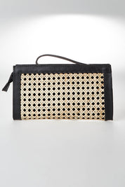 A model wearing size OneSize of the Raffles Clutch in colour Black, from the front, showing the whole outfit