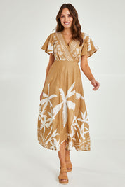 Model Madeline wearing size S of the Tropics Wrap Dress in colour Haven, from the front, showing the whole outfit