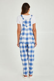 Model Madeline wearing size S of the Sailor Overalls in colour Bluecheck (Blue), from the back