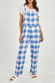 Model Madeline wearing size S of the Sailor Overalls in colour Bluecheck (Blue), from the front, cropped image