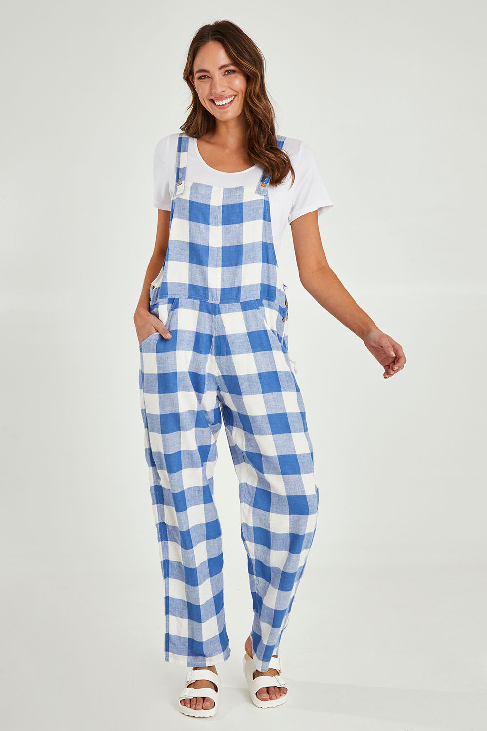 Model Madeline wearing size S of the Sailor Overalls in colour Bluecheck (Blue), from the front, showing the whole outfit