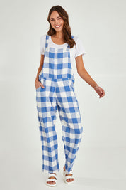 Model Madeline wearing size S of the Sailor Overalls in colour Bluecheck (Blue), from the front, showing the whole outfit