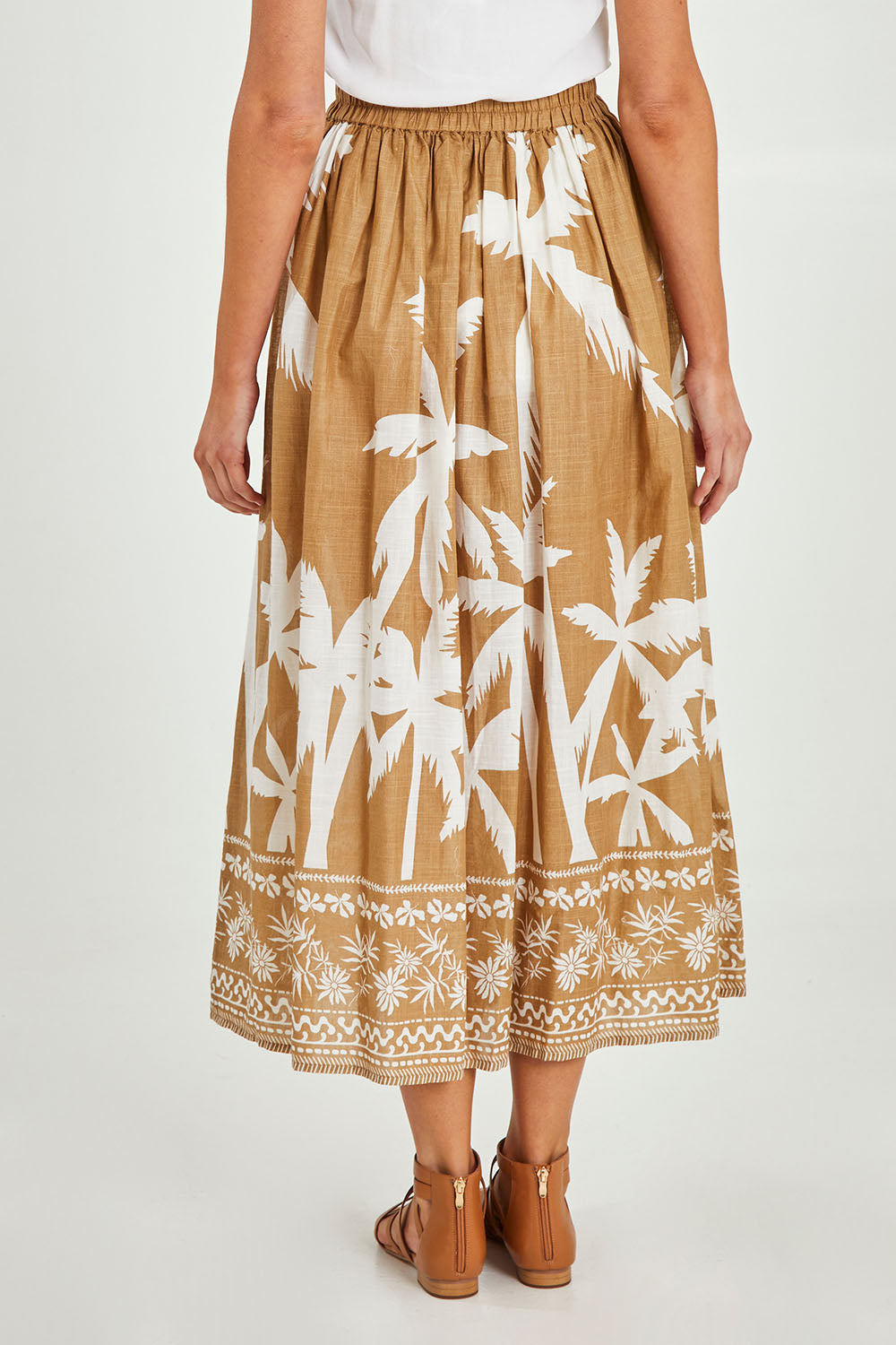 Model Madeline wearing size S of the Fly Away Skirt in colour Haven, from the back