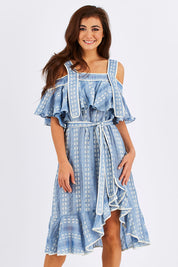 Model Chesska wearing size S of the Sweet William Dress in colour PetiteDais (Blue), from the front, cropped image