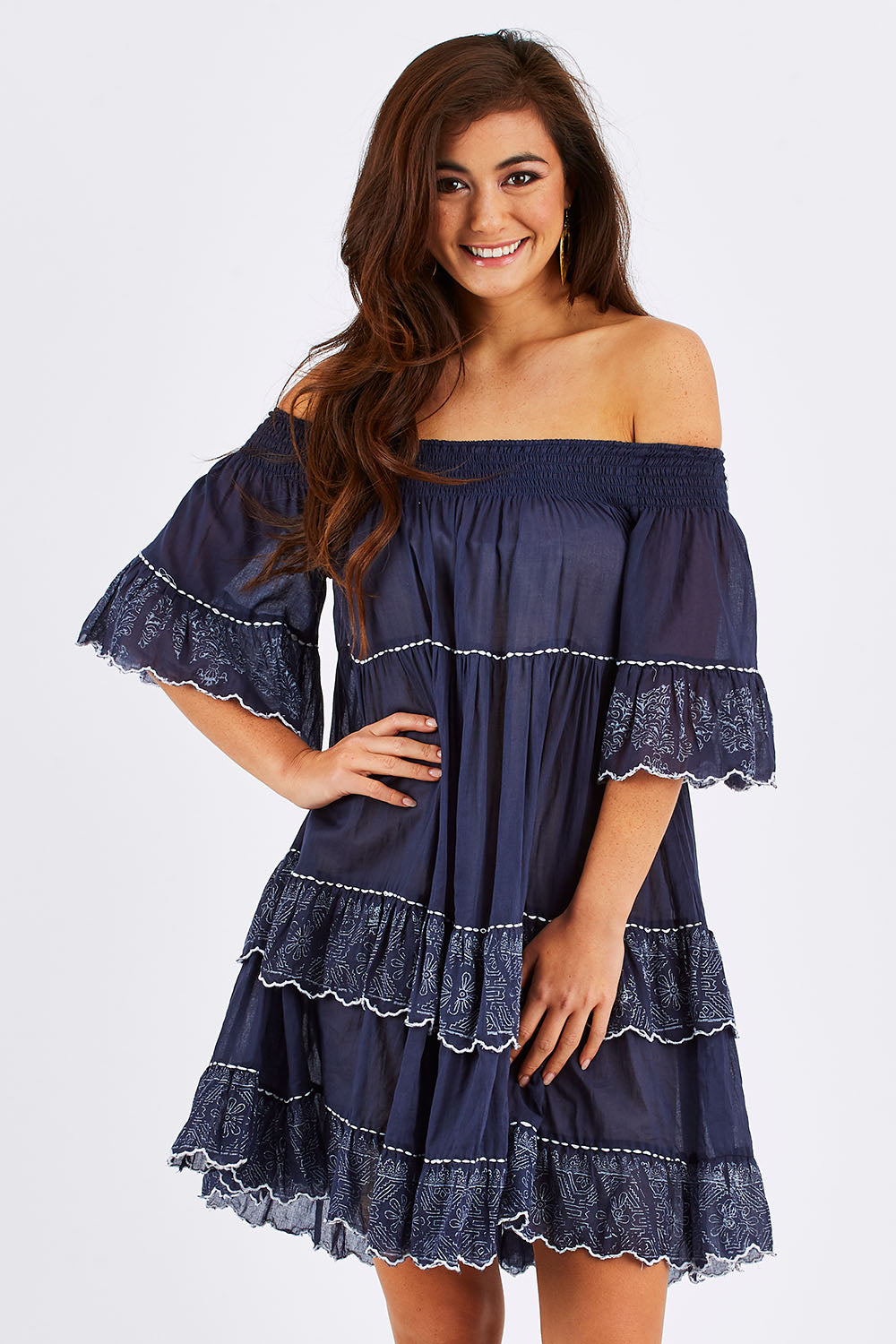 Model Chesska wearing size S-M of the Penzance Dress in colour Indigo (Blue), from the front, cropped image