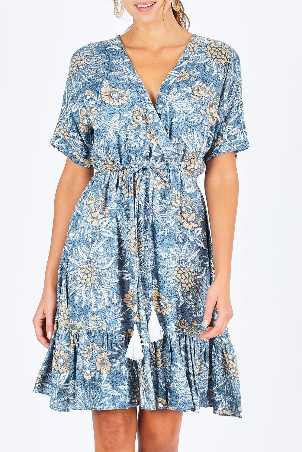 Model Madeline wearing the Boardwalk Dress in colour Havana (Blue), from the front, cropped image