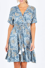 Model Madeline wearing the Boardwalk Dress in colour Havana (Blue), from the front, cropped image