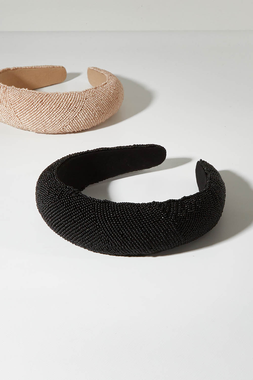 A model wearing size OneSize of the Beaded Solid Headband in colour Black (Black), from the front, showing the whole outfit