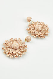 A model wearing the Bianca Earrings in colour Natural, from the front, showing the whole outfit