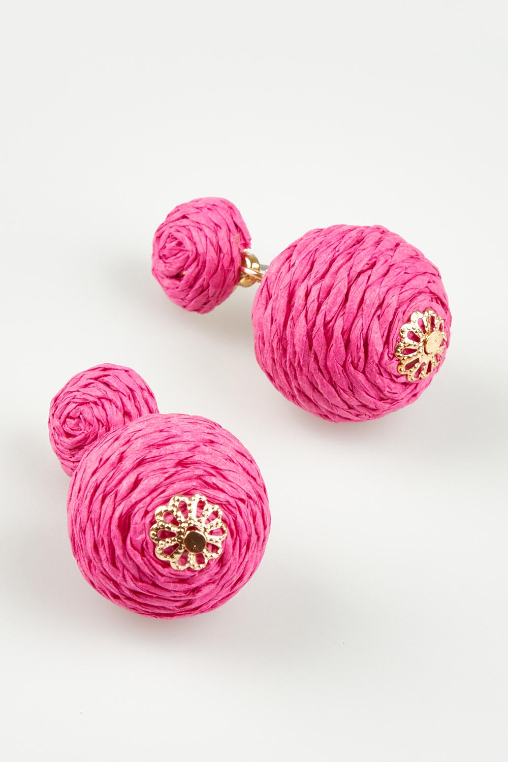 A model wearing the Ophilia Earrings in colour Hotpink (Pink), from the front, showing the whole outfit