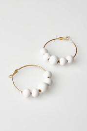 A model wearing size OneSize of the Salsa Earrings in colour White (White), from the front, showing the whole outfit