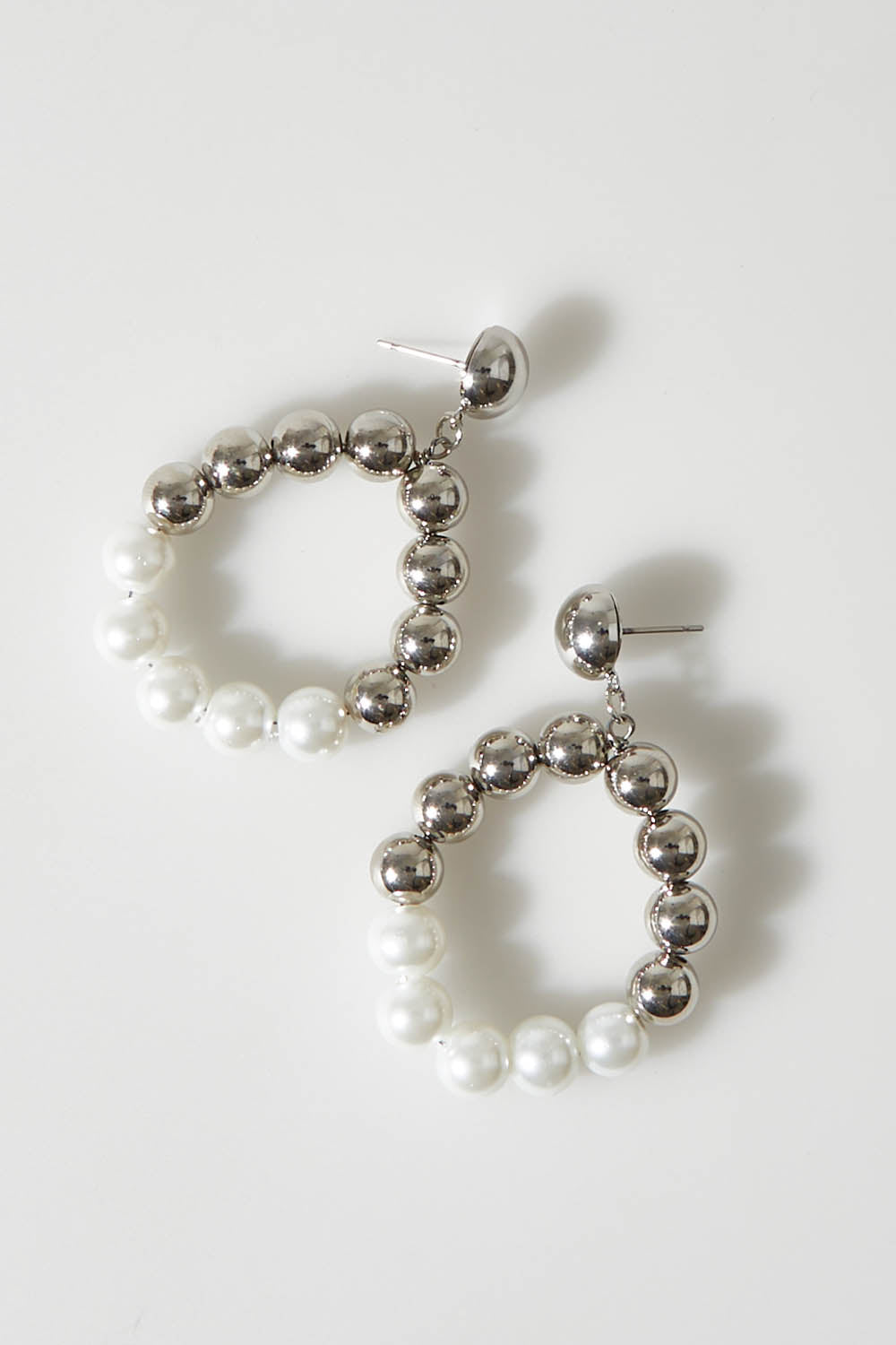 A model wearing size OneSize of the Holly Earrings in colour Silver (Metallics), from the front, showing the whole outfit