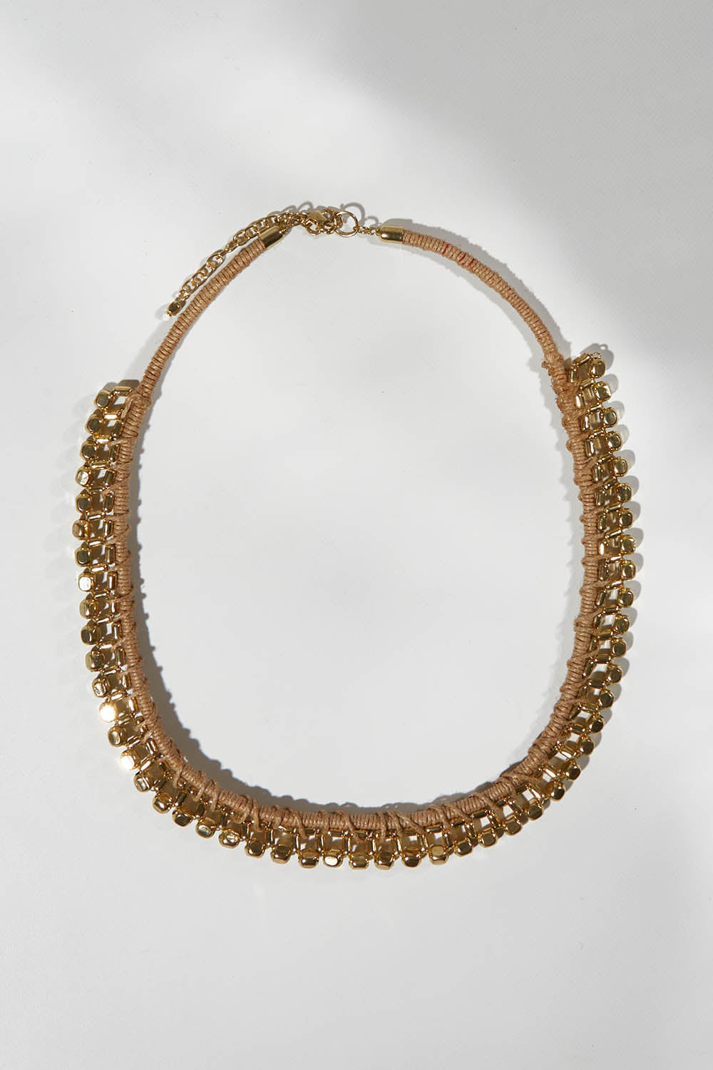 A model wearing size OneSize of the Darla Necklace in colour Gold (Metallics), from the front, showing the whole outfit