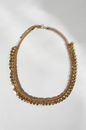 A model wearing size OneSize of the Darla Necklace in colour Gold (Metallics), from the front, showing the whole outfit