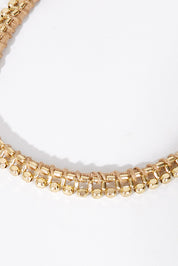 A model wearing size OneSize of the Darla Necklace in colour Gold (Metallics), from the front, showing the whole outfit
