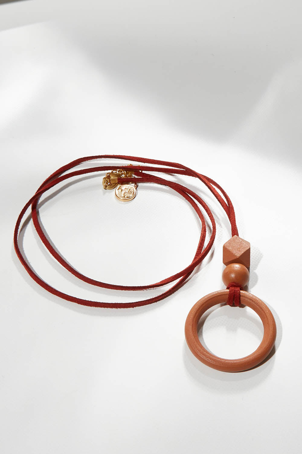 A model wearing size OneSize of the Salsa Necklace in colour Pecan, from the front, showing the whole outfit