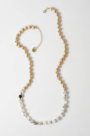 A model wearing size OneSize of the Sunset Long Necklace in colour Black (Black), from the front, showing the whole outfit