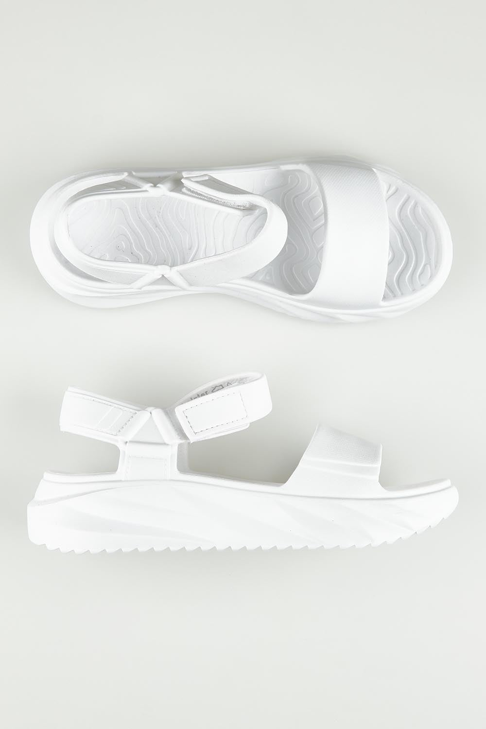 A model wearing size 6 of the Cloud Nine Eva Sandal in colour White (White), from the front, showing the whole outfit