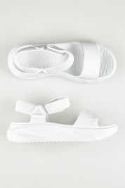 A model wearing size 6 of the Cloud Nine Eva Sandal in colour White (White), from the front, showing the whole outfit