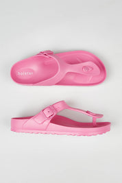 A model wearing size 7 of the Coastal EVA Slide in colour Hotpink (Pink), from the front, showing the whole outfit