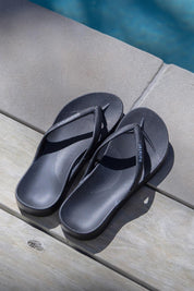 Product shot of the Islander Thong - Black in colour Black, from the front