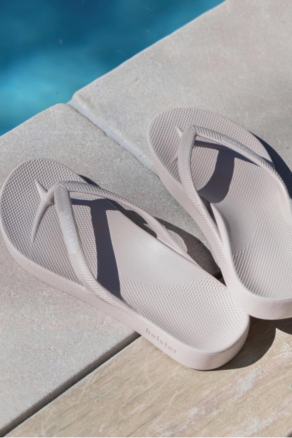 Product shot of the Islander Thong - Sand in colour Sand, from the back