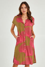 Model Madeline wearing size 10 of the Calforniai Dress in colour Fantasia (Green), from the front, cropped image