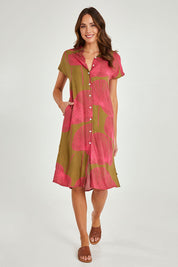 Model Madeline wearing size 10 of the Calforniai Dress in colour Fantasia (Green), from the front, showing the whole outfit