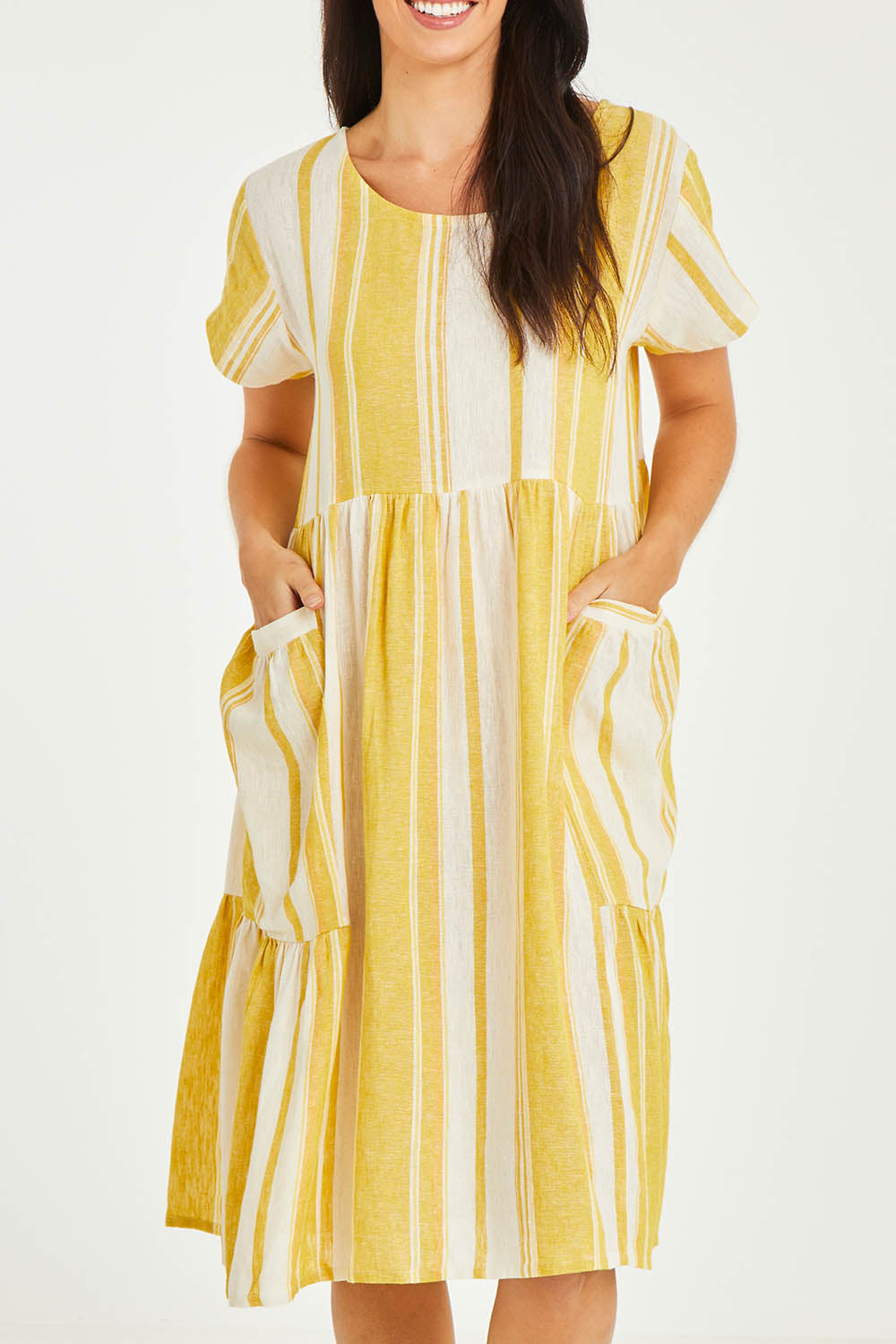 Model Stacey wearing size 10 of the Aireys Dress in colour Lemondrop, from the front, cropped image