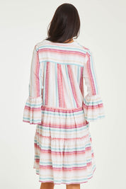 Model Stacey wearing size 10 of the Otway Dress in colour Candystrip (Pink), from the back