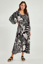 Model Madeline wearing size 10 of the Mimosa Dress in colour Brazil (Black), from the front, showing the whole outfit