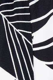 Product shot of the Mimosa Dress in colour Brazil (Black), detail
