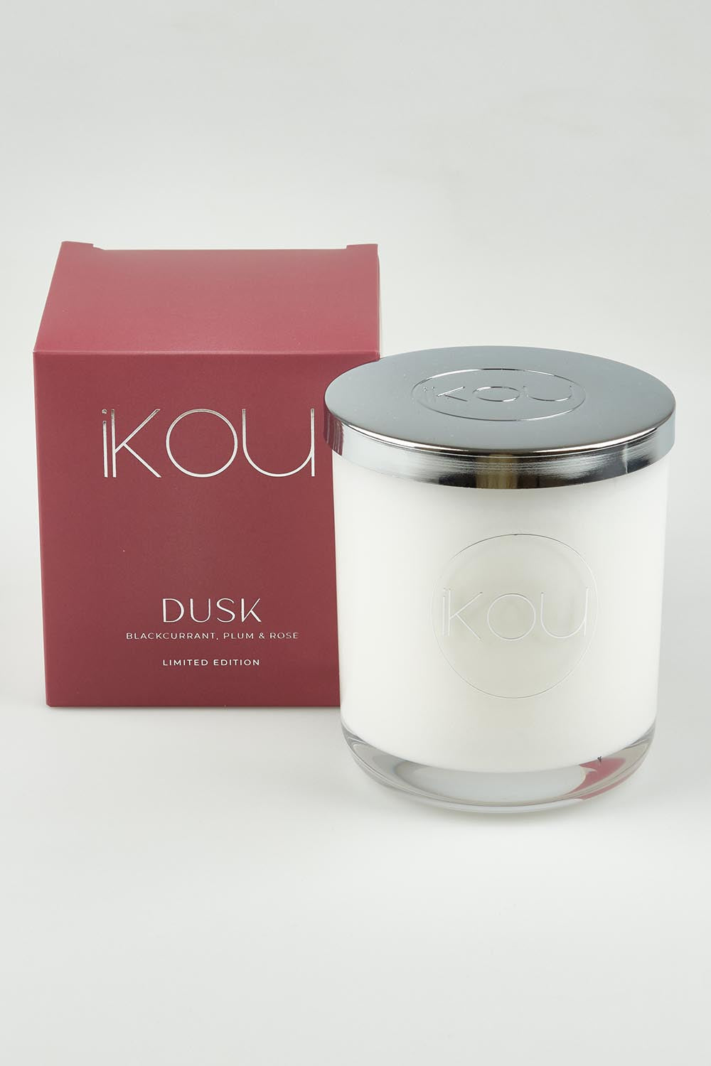 A model wearing the Limited Edition Candle in colour Dusk (Red), from the front, showing the whole outfit